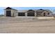 Spacious home boasting a 5-car garage with stone accents and a tile roof, offering ample parking at 13653 E Aloe Vera Dr, Scottsdale, AZ 85262