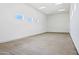 Expansive garage features tall ceilings, natural lighting from top windows and a smooth concrete floor at 13653 E Aloe Vera Dr, Scottsdale, AZ 85262