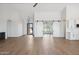Bright living room with modern sliding barn doors and wood-look tile flooring at 13653 E Aloe Vera Dr, Scottsdale, AZ 85262