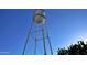 Tall, white water tower against a clear blue sky at 158 W Commerce Ct, Gilbert, AZ 85233