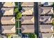 An aerial view capturing a neighborhood, displaying uniform roofs and neatly arranged streets at 955 S Henry Ln, Gilbert, AZ 85296