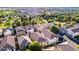 Aerial view displays neatly arranged houses with lush greenery, showcasing a suburban community at 955 S Henry Ln, Gilbert, AZ 85296