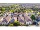 Aerial view displays neatly arranged houses with lush greenery, showcasing a suburban community at 955 S Henry Ln, Gilbert, AZ 85296