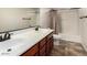 Bright bathroom featuring a double sink vanity, grey flooring and shower and tub combo at 955 S Henry Ln, Gilbert, AZ 85296