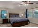 This bedroom features a large bed, matching nightstands, and plenty of natural light at 955 S Henry Ln, Gilbert, AZ 85296