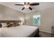 Charming bedroom features a cozy bed, large window, and ceiling fan, offering a comfortable retreat at 955 S Henry Ln, Gilbert, AZ 85296