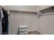 This walk-in closet has plenty of space for storage with shelving and space to hang clothing at 955 S Henry Ln, Gilbert, AZ 85296