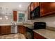 This kitchen features granite countertops and stainless steel appliances, including a microwave and stove at 955 S Henry Ln, Gilbert, AZ 85296