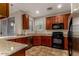 Well-equipped kitchen with granite countertops, stainless steel appliances, and ample cabinet space at 955 S Henry Ln, Gilbert, AZ 85296
