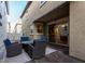 Spacious patio features a fire pit table, comfortable seating and a sliding glass door at 955 S Henry Ln, Gilbert, AZ 85296