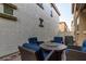 Inviting patio features a fire pit table and comfortable blue cushioned seating at 955 S Henry Ln, Gilbert, AZ 85296