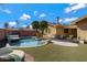 Backyard with a beautiful pool, outdoor seating, and lush landscaping offers a peaceful retreat at 1859 N Morris --, Mesa, AZ 85201