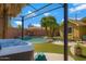 Amazing backyard features a hot tub, outdoor seating, and a sparkling pool surrounded by palm trees at 1859 N Morris --, Mesa, AZ 85201