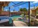 Luxurious backyard with a pool, hot tub, lounge seating, and lush landscaping at 1859 N Morris --, Mesa, AZ 85201