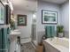 Bathroom features separate sinks, a bathtub, and a glass shower at 1859 N Morris --, Mesa, AZ 85201