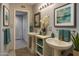 This bathroom features two pedestal sinks and an attractive light fixture at 1859 N Morris --, Mesa, AZ 85201