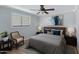 This bedroom is furnished with a queen-sized bed and bedside tables at 1859 N Morris --, Mesa, AZ 85201
