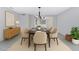 Formal dining room with natural lighting, stylish light fixture, and wood flooring at 1859 N Morris --, Mesa, AZ 85201