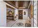 Bright foyer features tile flooring, skylight, wood ceiling and decorative wall art at 1859 N Morris --, Mesa, AZ 85201