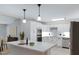 Modern kitchen with white cabinets, stainless steel appliances, and a center island with marble countertop at 1859 N Morris --, Mesa, AZ 85201