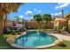 Inviting backyard oasis with a sparkling pool, hot tub, and a relaxing seating area surrounded by lush greenery at 1859 N Morris --, Mesa, AZ 85201