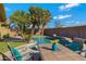 Backyard pool area featuring a serene pool, palm trees, and an inviting patio table at 1859 N Morris --, Mesa, AZ 85201