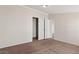 Bedroom with double door closet and neutral carpeting at 2612 E Sandra Ter, Phoenix, AZ 85032