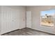 Bedroom with wood-look floors and a window at 2612 E Sandra Ter, Phoenix, AZ 85032