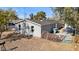 Rear view of the house showing a small yard and gated area at 2612 E Sandra Ter, Phoenix, AZ 85032