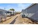 Exterior view of a mobile home with a ramp and gravel driveway at 2612 E Sandra Ter, Phoenix, AZ 85032