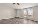 Bright living room featuring wood-look floors and large windows at 2612 E Sandra Ter, Phoenix, AZ 85032