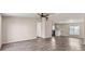 Spacious living room with wood-look floors and ceiling fan at 2612 E Sandra Ter, Phoenix, AZ 85032