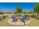 Community fire pit with chairs and landscaping at 6145 S Antonio --, Mesa, AZ 85212