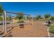 Playground area with tire swing and climbing frame at 6145 S Antonio --, Mesa, AZ 85212