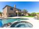 An outdoor pool and jacuzzi are located in this home's backyard and patio area at 10646 E Butherus Dr, Scottsdale, AZ 85255