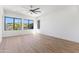 Spacious bedroom with a ceiling fan and large windows offering natural light and views at 10646 E Butherus Dr, Scottsdale, AZ 85255