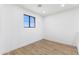 Bright bedroom with wood floors, neutral walls, and window allowing plenty of natural light at 10646 E Butherus Dr, Scottsdale, AZ 85255