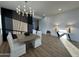 Modern dining room featuring a large table and hardwood floors at 10646 E Butherus Dr, Scottsdale, AZ 85255