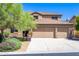 Charming two-story home with three-car garage, desert landscaping, and classic Southwest design at 10646 E Butherus Dr, Scottsdale, AZ 85255