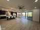 Open concept kitchen with island, stainless steel appliances, and patio access at 10646 E Butherus Dr, Scottsdale, AZ 85255