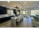 Modern kitchen with dark cabinetry, a large island, and stainless steel appliances at 10646 E Butherus Dr, Scottsdale, AZ 85255