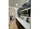 View of kitchen with dining room access and stainless steel appliances at 10646 E Butherus Dr, Scottsdale, AZ 85255