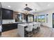 Modern kitchen with a large center island, stainless steel appliances, and designer lighting at 10646 E Butherus Dr, Scottsdale, AZ 85255