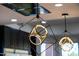 Close-up of a modern pendant light fixture in the kitchen, showcasing its unique geometric design at 10646 E Butherus Dr, Scottsdale, AZ 85255