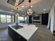 Modern kitchen with large island and high-end finishes at 10646 E Butherus Dr, Scottsdale, AZ 85255