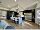 Modern kitchen with dark cabinetry and a large island at 10646 E Butherus Dr, Scottsdale, AZ 85255