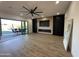 Spacious living room with fireplace and sliding doors to backyard at 10646 E Butherus Dr, Scottsdale, AZ 85255