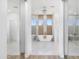 Bright main bathroom with freestanding tub, dual sink vanity, and marble tile at 10646 E Butherus Dr, Scottsdale, AZ 85255