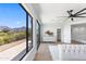 Bright main bedroom featuring a view of balcony with mountain views at 10646 E Butherus Dr, Scottsdale, AZ 85255