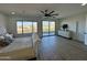 Bright main bedroom features a plush bed, large windows, and a ceiling fan at 10646 E Butherus Dr, Scottsdale, AZ 85255